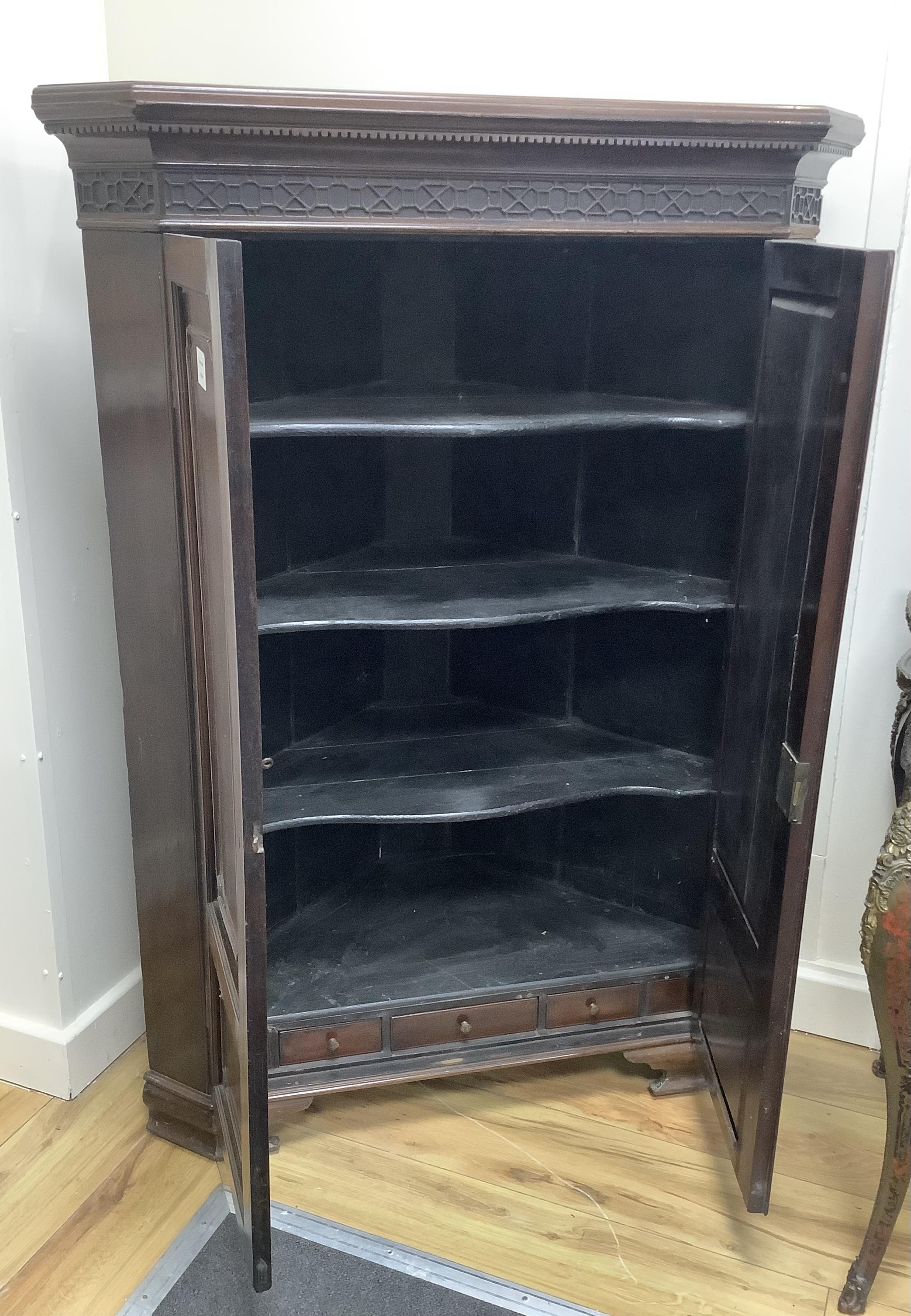 A George III and later mahogany corner cabinet, width 86cm, depth 45cm, height 123cm. Condition - fair, lacks some moulding to door